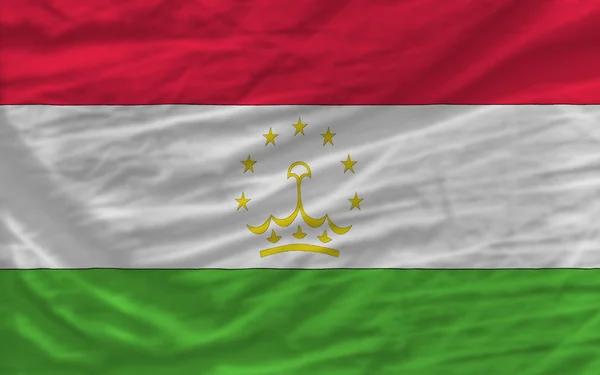 Kompletní zamával státní vlajka Tádžikistánu na pozadí — Stock fotografie