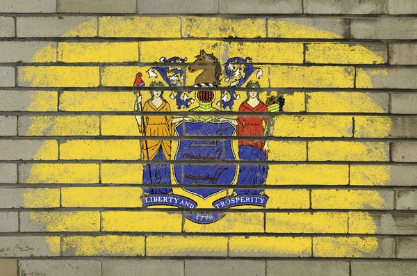 Grunge flagga oss delstaten new jersey på tegelvägg målade med — Stockfoto
