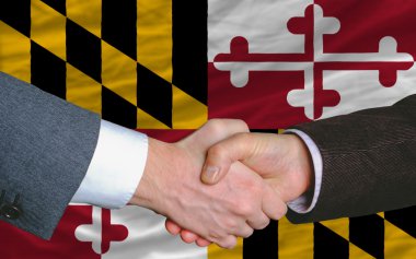 In front of american state flag of maryland two businessmen hand clipart