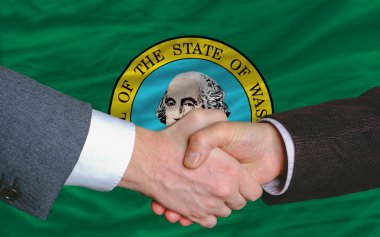In front of american state flag of west washington two businessm clipart