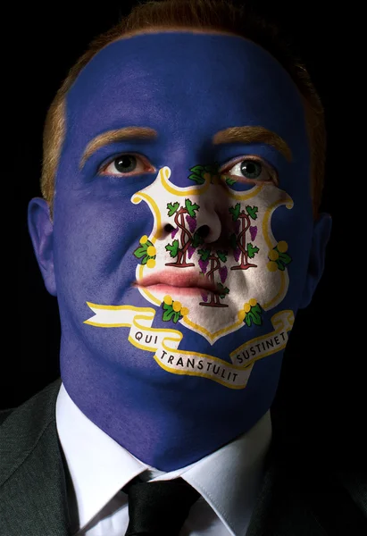 Nós estado da bandeira connecticut pintado rosto de homem de negócios ou poli — Fotografia de Stock