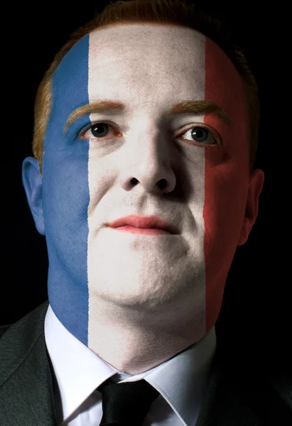 Gesicht eines seriösen Geschäftsmannes oder Politikers in den Farben von f — Stockfoto