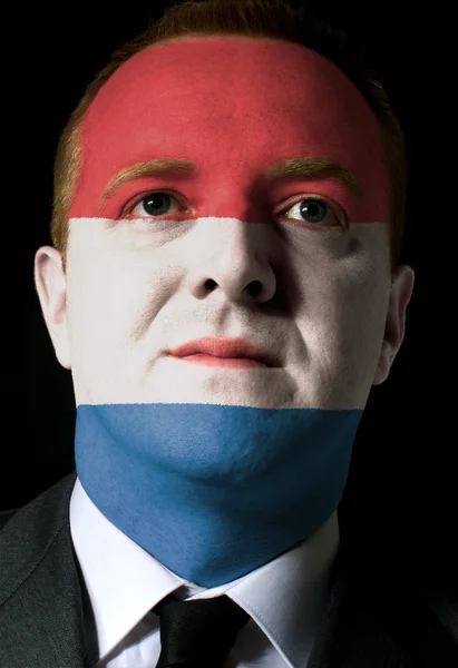 Gesicht eines seriösen Geschäftsmannes oder Politikers in den Farben der h — Stockfoto