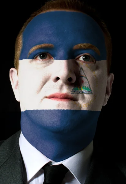 Πρόσωπο της σοβαροί επιχειρηματία ή πολιτικός που χρωματίζονται στα χρώματα του ν — Φωτογραφία Αρχείου