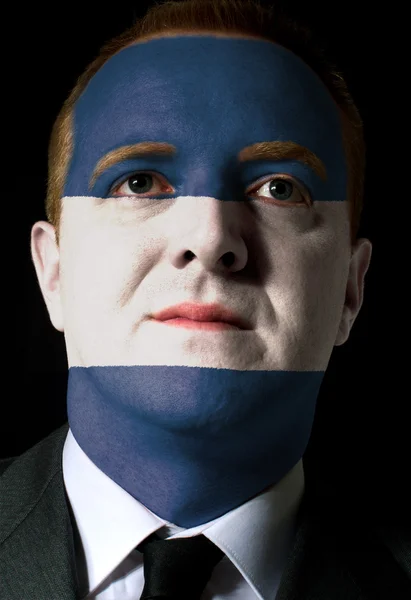 N の色で塗られて深刻なビジネスマンや政治家の顔 — ストック写真