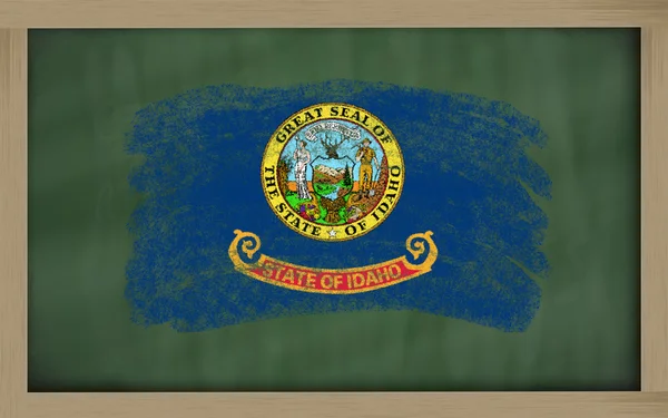 Flag of us state of idaho on blackboard painted with chalk — Stock Photo, Image