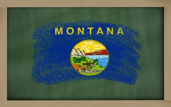 Flag of us state of montana on blackboard painted with chalk — Stock Photo, Image