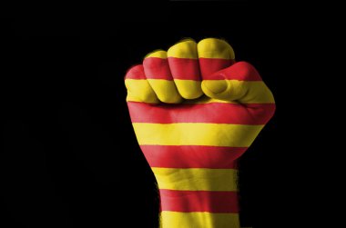 Fist painted in colors of catalonia flag clipart