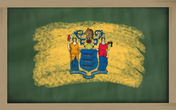 Flag of us state of new jersey on blackboard painted with chalk — Stock Photo, Image