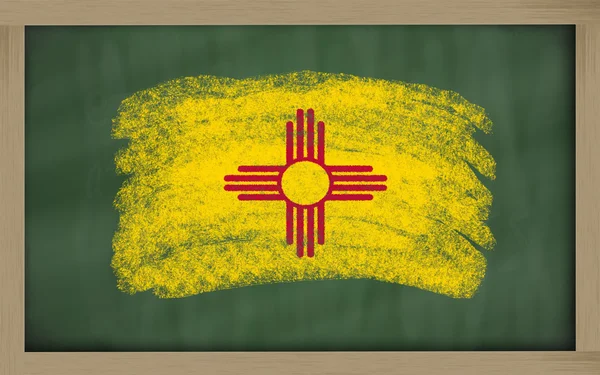 Flag of us state of new mexico on blackboard painted with chalk — Stock Photo, Image