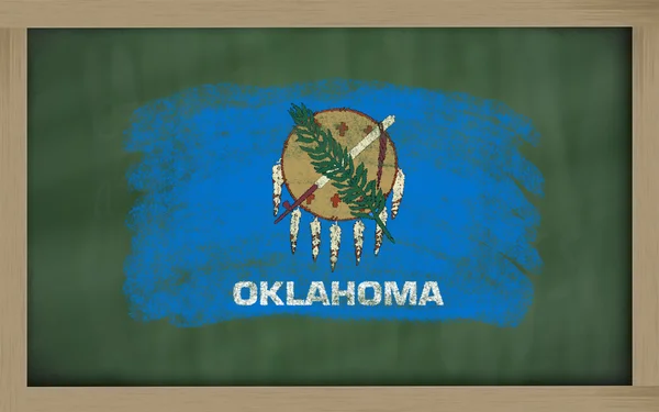 Flag of us state of oklahoma on blackboard painted with chalk — Stock Photo, Image