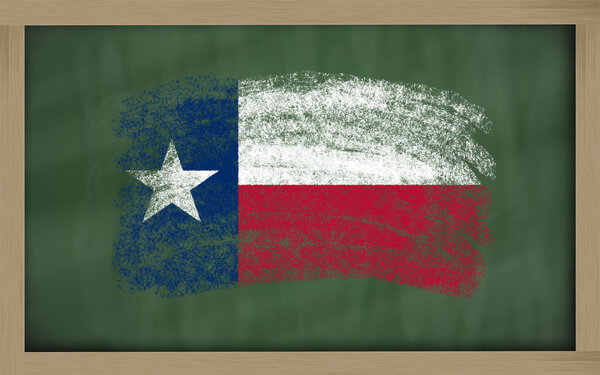 Flag of us state of texas on blackboard painted with chalk
