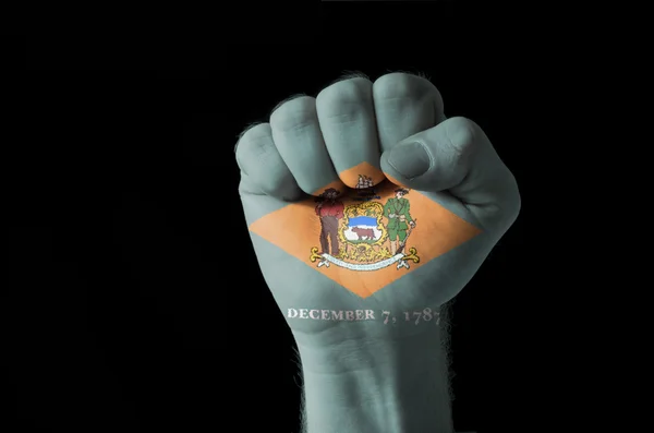 Fist painted in colors of us state of delaware flag — Stock Photo, Image
