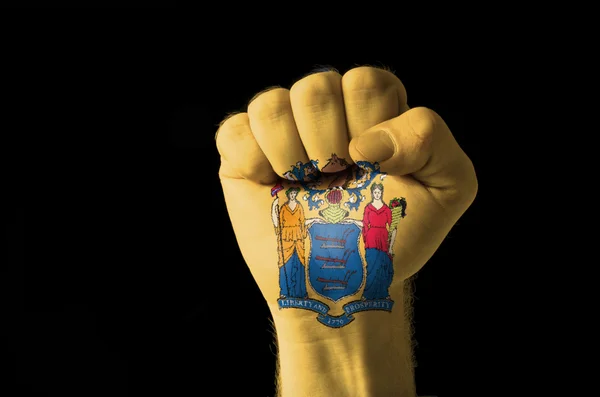 拳头绘在我们新泽西的州旗的颜色 — 图库照片