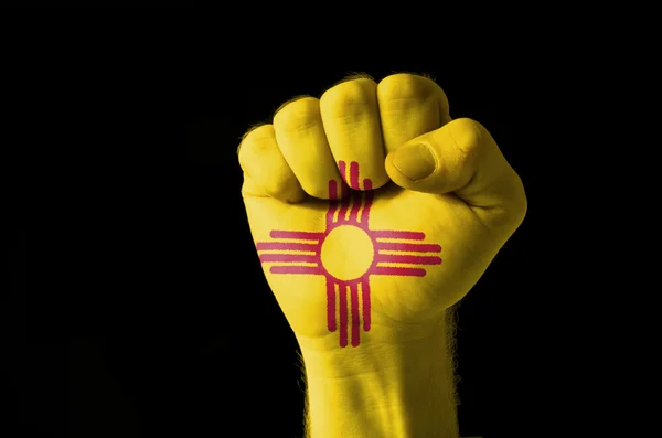 Fist painted in colors of us state of new mexico flag — Stock Photo, Image