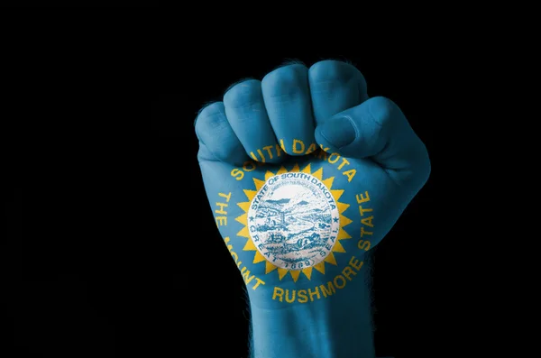 Fist painted in colors of us state of south dakota flag — Stock Photo, Image