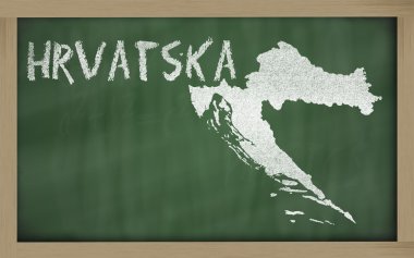 Outline map of croatia on blackboard clipart