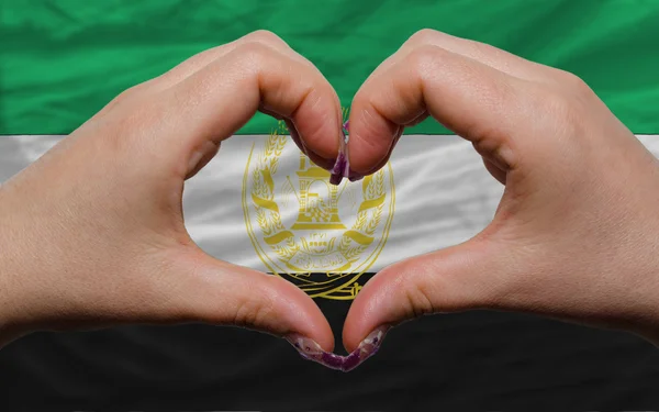 Sobre la bandera nacional de Afganistán mostró el corazón y el gesto de amor — Foto de Stock
