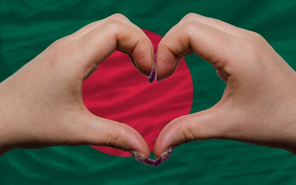 Over national flag of bangladesh showed heart and love gesture m — Stock Photo, Image