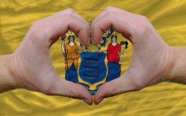 Over american state flag of new jersey showed heart and love ges clipart