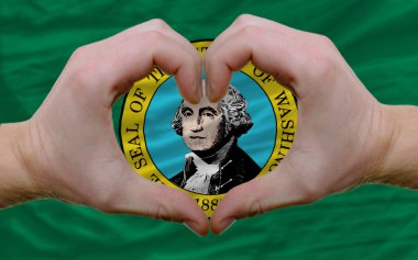 Over american state flag of washington showed heart and love ges clipart
