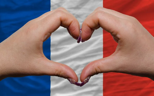 Over nationale vlag van Frankrijk toonde hart en liefde gebaar gemaakt — Stockfoto