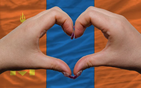Over nationale vlag van Mongolië toonde hart en liefde gebaar mad — Stockfoto