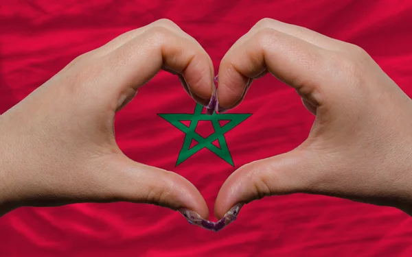 Over national flag of morocco showed heart and love gesture made — Stock Photo, Image