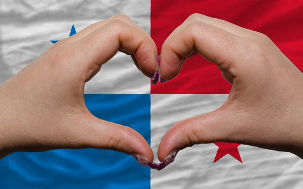 Over national flag of panama showed heart and love gesture made — Stock Photo, Image