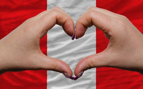 Sopra bandiera nazionale del Perù ha mostrato il cuore e l'amore gesto fatto da — Foto Stock