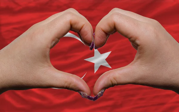 Over national flag of turkey showed heart and love gesture made — Stock Photo, Image