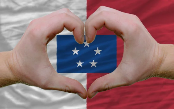 Nad flagą franceville pokazał gest serca i miłości przez h — Zdjęcie stockowe