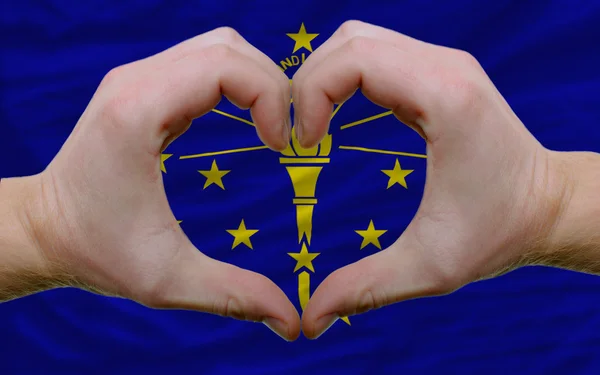Over american state flag of indiana showed heart and love gestur — Stock Photo, Image