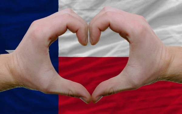 Over american state flag of texas showed heart and love gesture — Stok fotoğraf