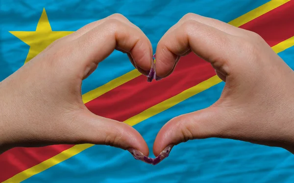 Sopra bandiera di congo ha mostrato il cuore e il gesto di amore fatto da mani — Foto Stock