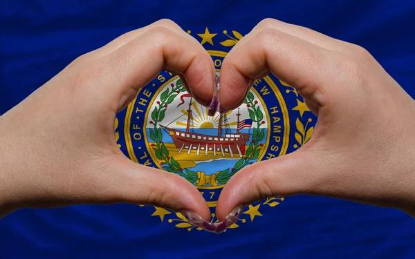 Over american state flag of new hampshire showed heart and love — Stock Photo, Image