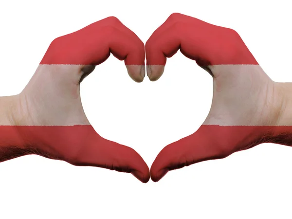 Hart en liefde gebaar in Oostenrijk vlag kleuren door handen geïsoleerd — Stockfoto
