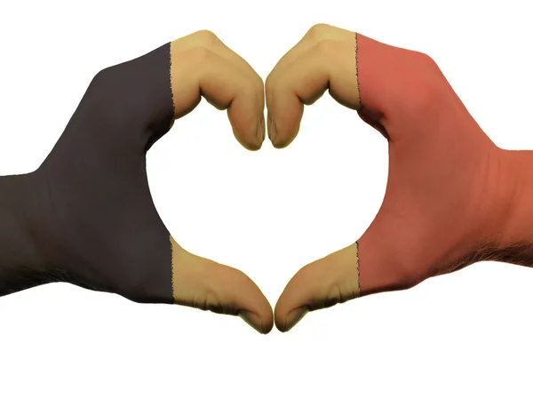 Herz- und Liebesgeste in den Farben der belgischen Flagge an isolierten Händen — Stockfoto