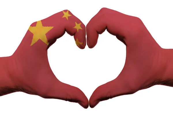 Hart en liefde gebaar in china vlag kleuren door handen geïsoleerd op — Stockfoto