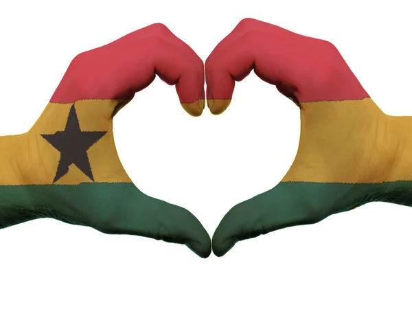 Hart en liefde gebaar in ghana vlag kleuren door handen geïsoleerd op — Stockfoto