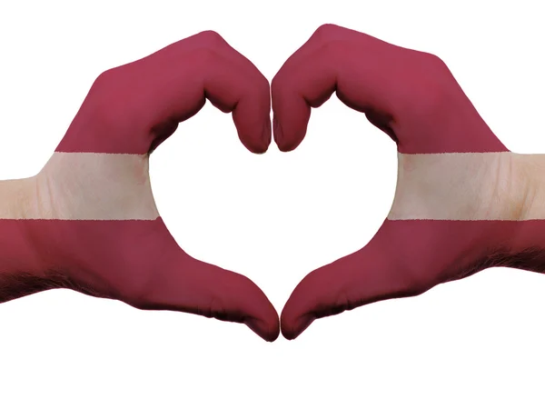 stock image Heart and love gesture in latvia flag colors by hands isolated o