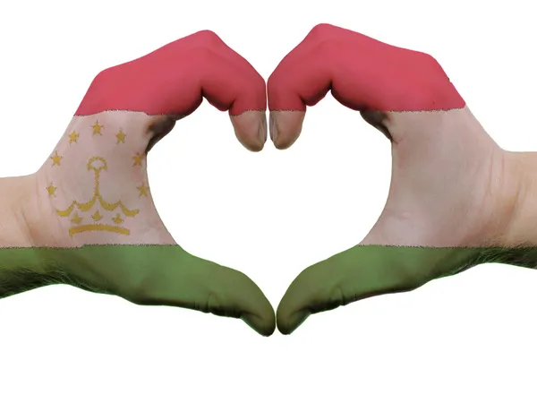 手人里でフラグの色はタジキスタンの心と愛のジェスチャー — ストック写真