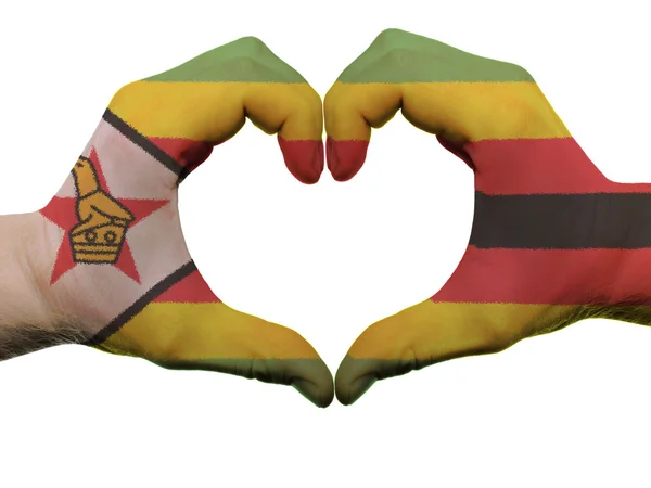 Hart en liefde gebaar in zimbabwe vlag kleuren door handen geïsoleerd — Stockfoto