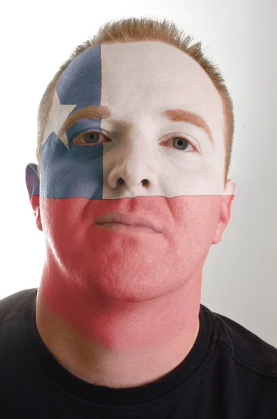 Face of serious patriot man painted in colors of chile flag — Stock Photo, Image