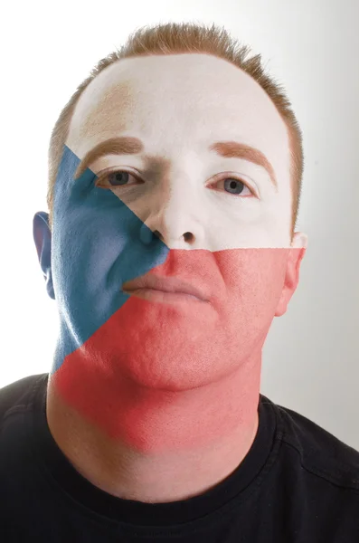 Face of serious patriot man painted in colors of czech flag — Stock Photo, Image