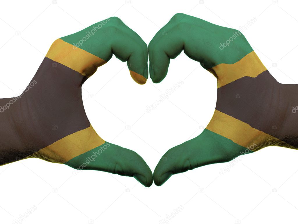 Gesture made by jamaica flag colored hands showing symbol of heart and love, isolated on white background
