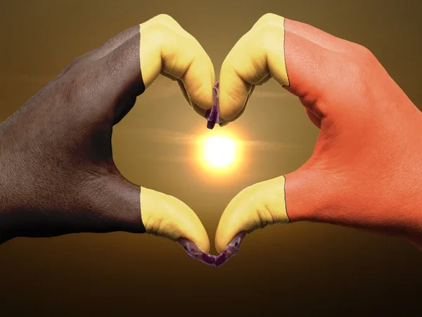 Heart and love gesture by hands colored in belgium flag during b — Stock Photo, Image