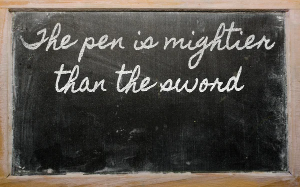 Expression - The pen is mightier than the sword - written on a — Stock Photo, Image