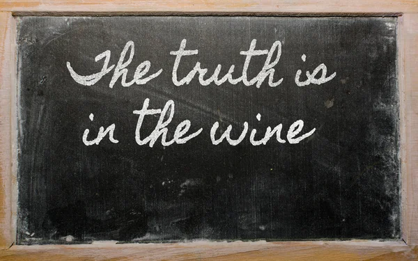 Expression - The truth is in the wine - written on a school bla — Stock Photo, Image