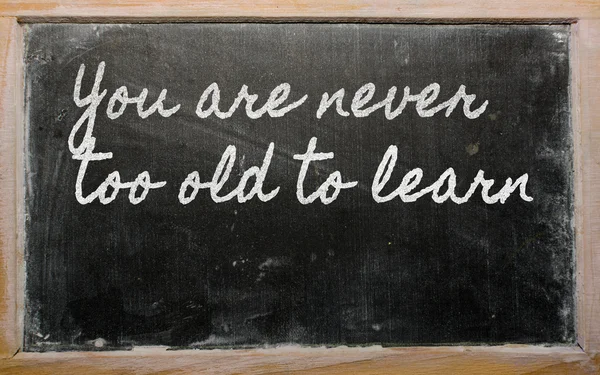 Expression - You are never too old to learn - written on a scho — Stock Photo, Image